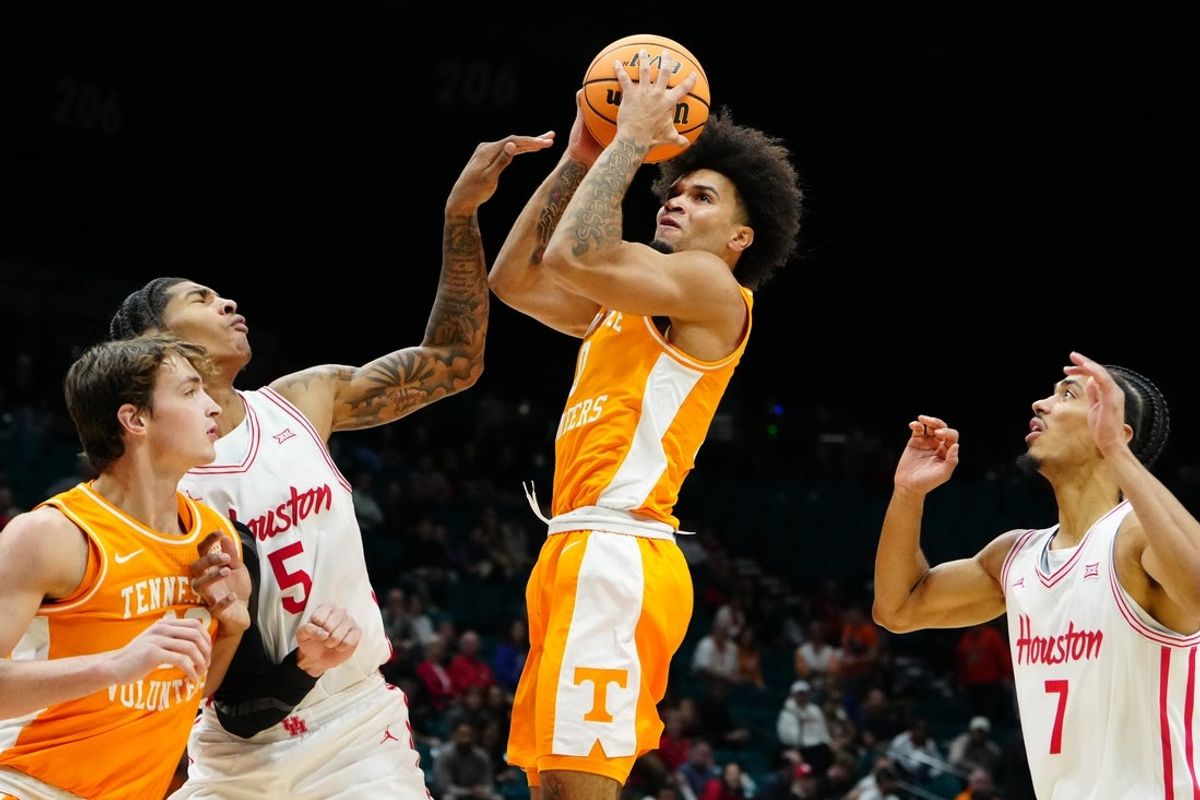 Nov 25, 2025; Las Vegas, NV, USA; Tennessee Volunteers guard Ja'Kobi Gillespie (0) shoots the ball against Houston Cougars center Chris Cenac Jr. (5) in a 2025 Players Era Festival group play game during the second half at MGM Grand Garden Arena. Mandatory Credit: Stephen R. Sylvanie-Imagn Images
