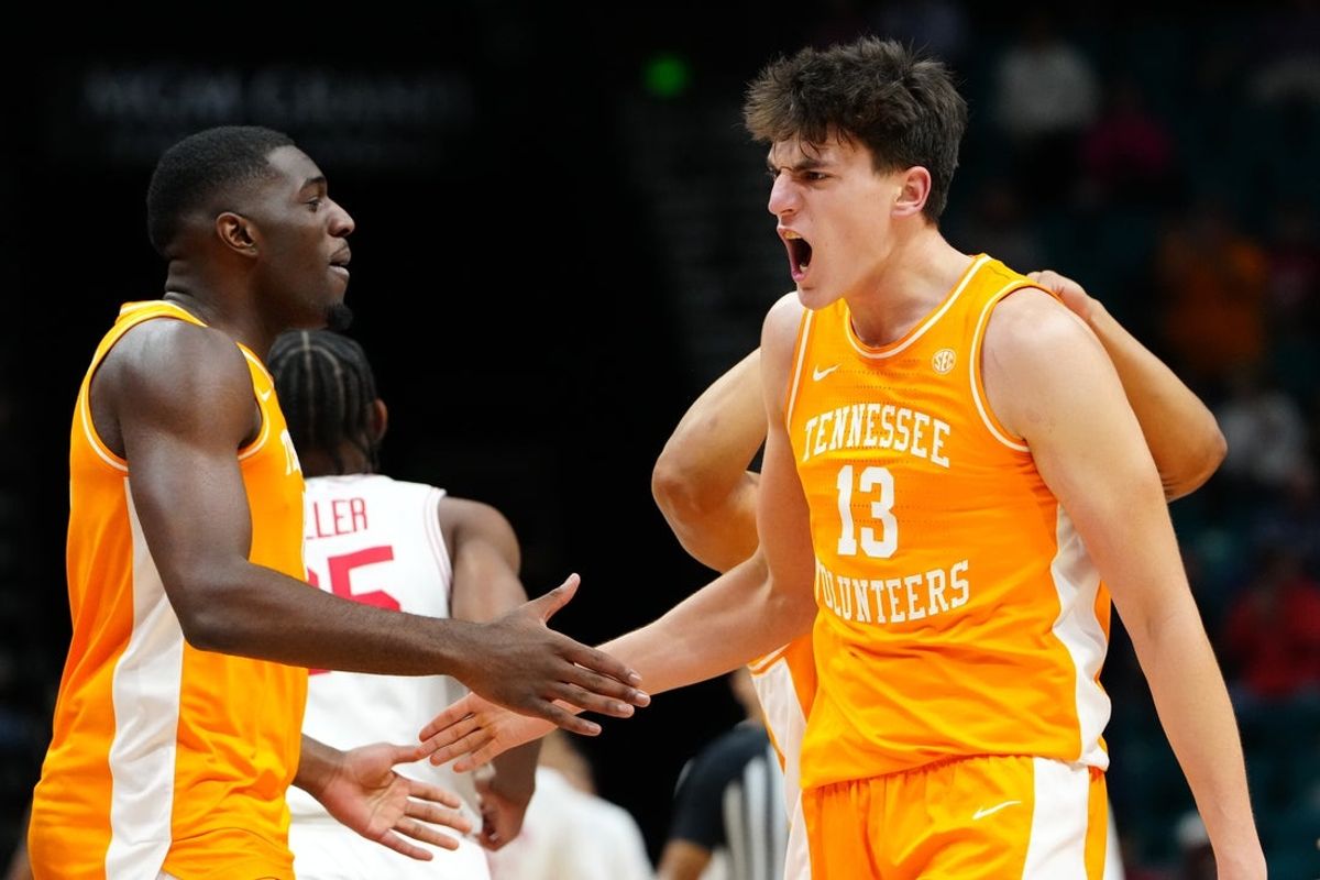 Nov 25, 2025; Las Vegas, NV, USA; Tennessee Volunteers forward J.P. Estrella (13) and forward Dewayne Brown II (6) react in a 2025 Players Era Festival group play game against the Houston Cougars during the second half at MGM Grand Garden Arena. Mandatory Credit: Stephen R. Sylvanie-Imagn Images