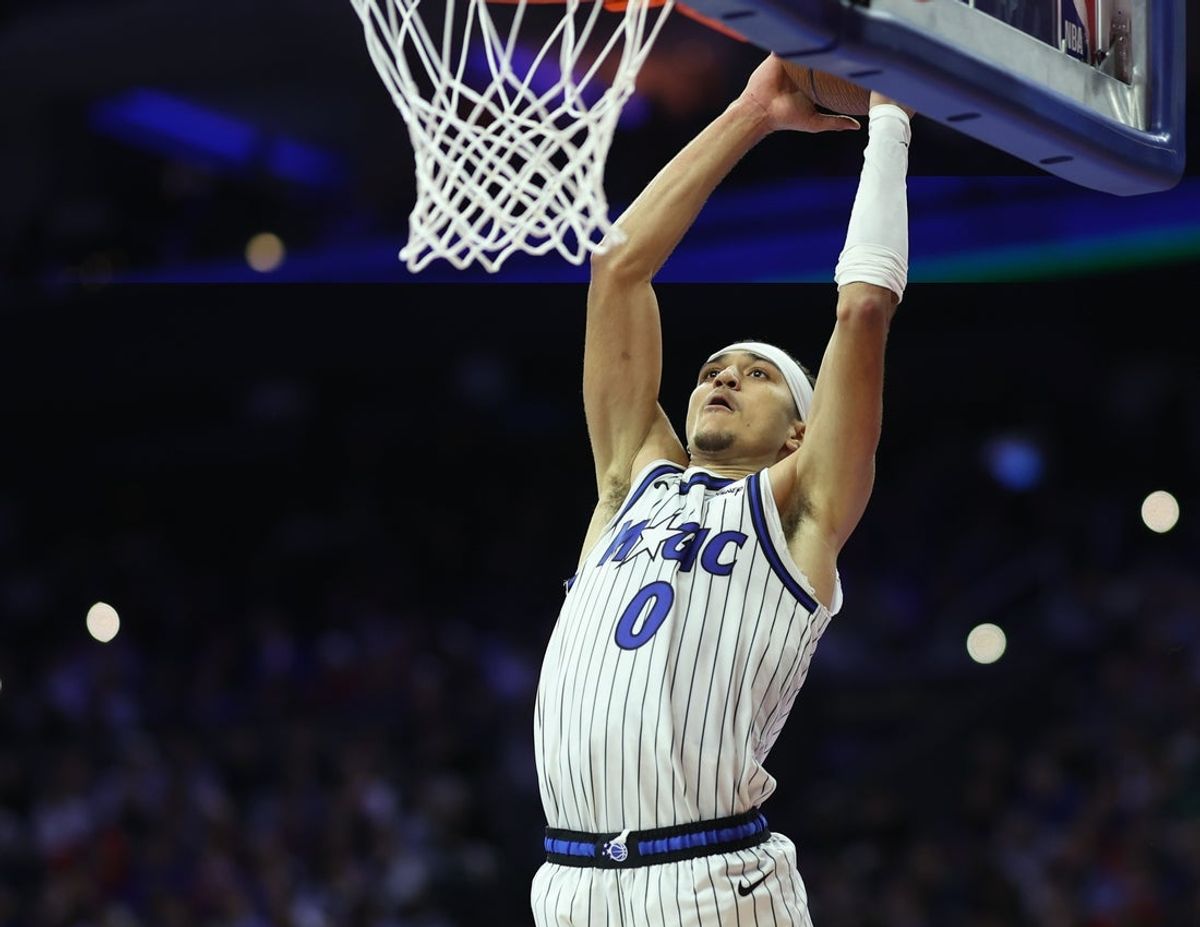 Nov 25, 2025; Philadelphia, Pennsylvania, USA; Orlando Magic guard Anthony Black (0) duns the ball during the second quarter against the Philadelphia 76ers at Xfinity Mobile Arena. Mandatory Credit: Bill Streicher-Imagn Images