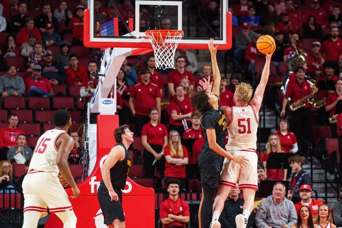 Nov 25, 2025; Lincoln, Nebraska, USA; Nebraska Cornhuskers forward Rienk Mast (51) shoots the ball against Winthrop Eagles forward Tai Hamilton (21) during the first half at Pinnacle Bank Arena. Mandatory Credit: Dylan Widger-Imagn Images