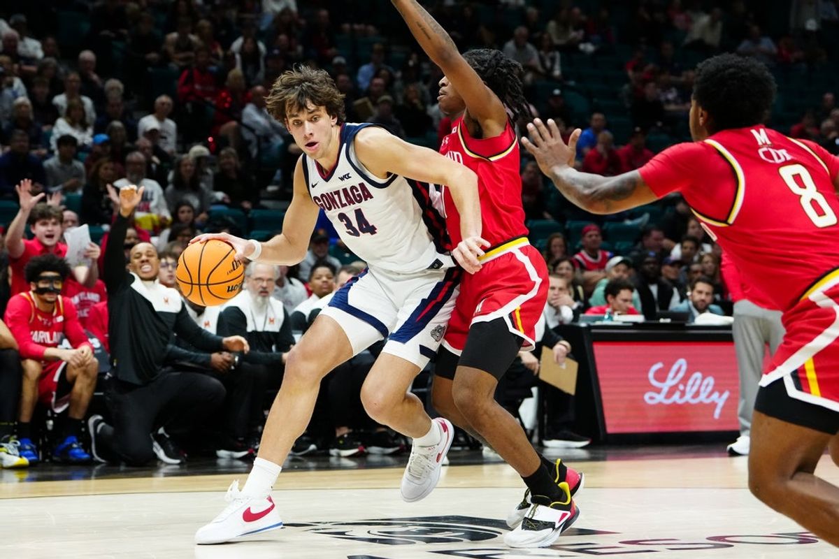 Nov 25, 2025; Las Vegas, NV, USA; Gonzaga Bulldogs forward Braden Huff (34) backs into Maryland Terrapins guard Andre Mills (7) in the first half in a 2025 Players Era Festival group play game at MGM Grand Garden Arena. Mandatory Credit: Stephen R. Sylvanie-Imagn Images
