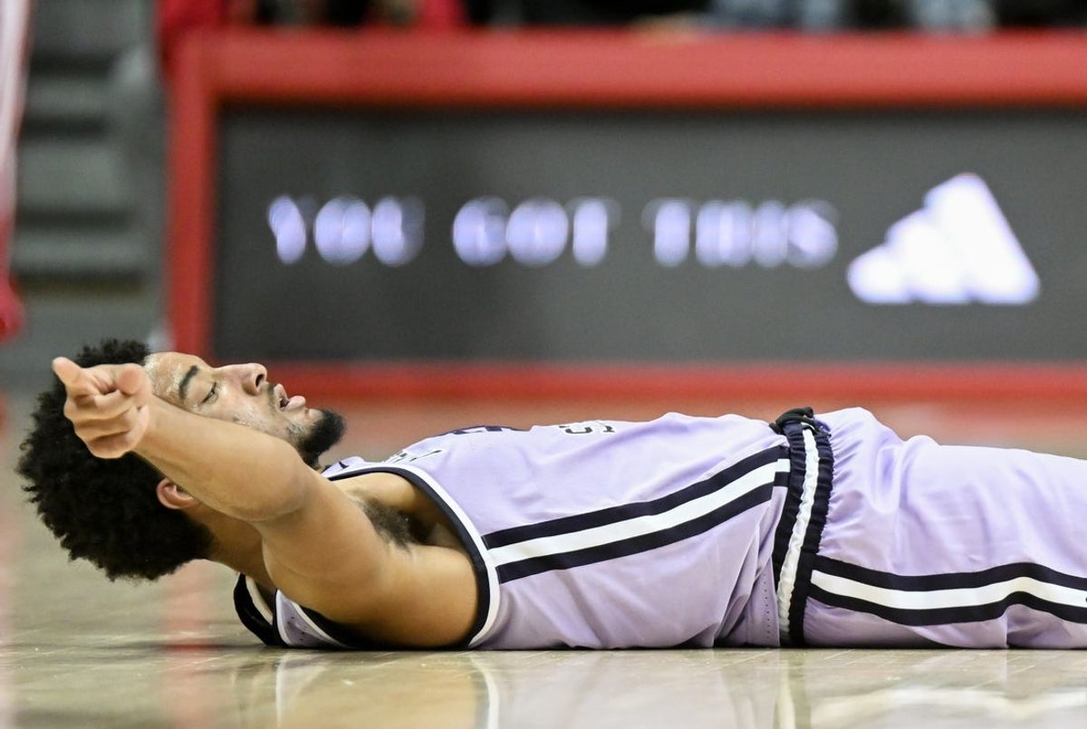 Nov 25, 2025; Bloomington, Indiana, USA; Kansas State Wildcats guard PJ Haggerty (4) celebrates after drawing an offensive foul during the second half against the Indiana Hoosiers at Simon Skjodt Assembly Hall. Mandatory Credit: Robert Goddin-Imagn Images