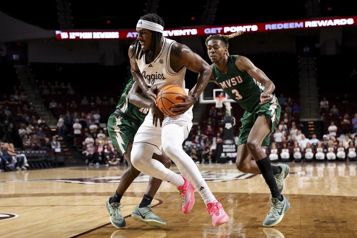 Nov 25, 2025; College Station, Texas, USA; Texas A&M Aggies forward Mackenzie Mgbako (21) is double teamed by Mississippi Valley State Delta Devils during the first half at Reed Arena. Mandatory Credit: Maria Lysaker-Imagn Images
