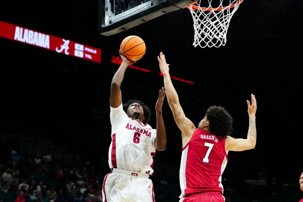 Nov 25, 2025; Las Vegas, Nevada, USA; Alabama Crimson Tide forward London Jemison (6) shoots while defended by UNLV Rebels guard Al Green (7) in a 2025 Players Era Festival group play game at MGM Grand Garden Arena. Mandatory Credit: Stephen R. Sylvanie-Imagn Images