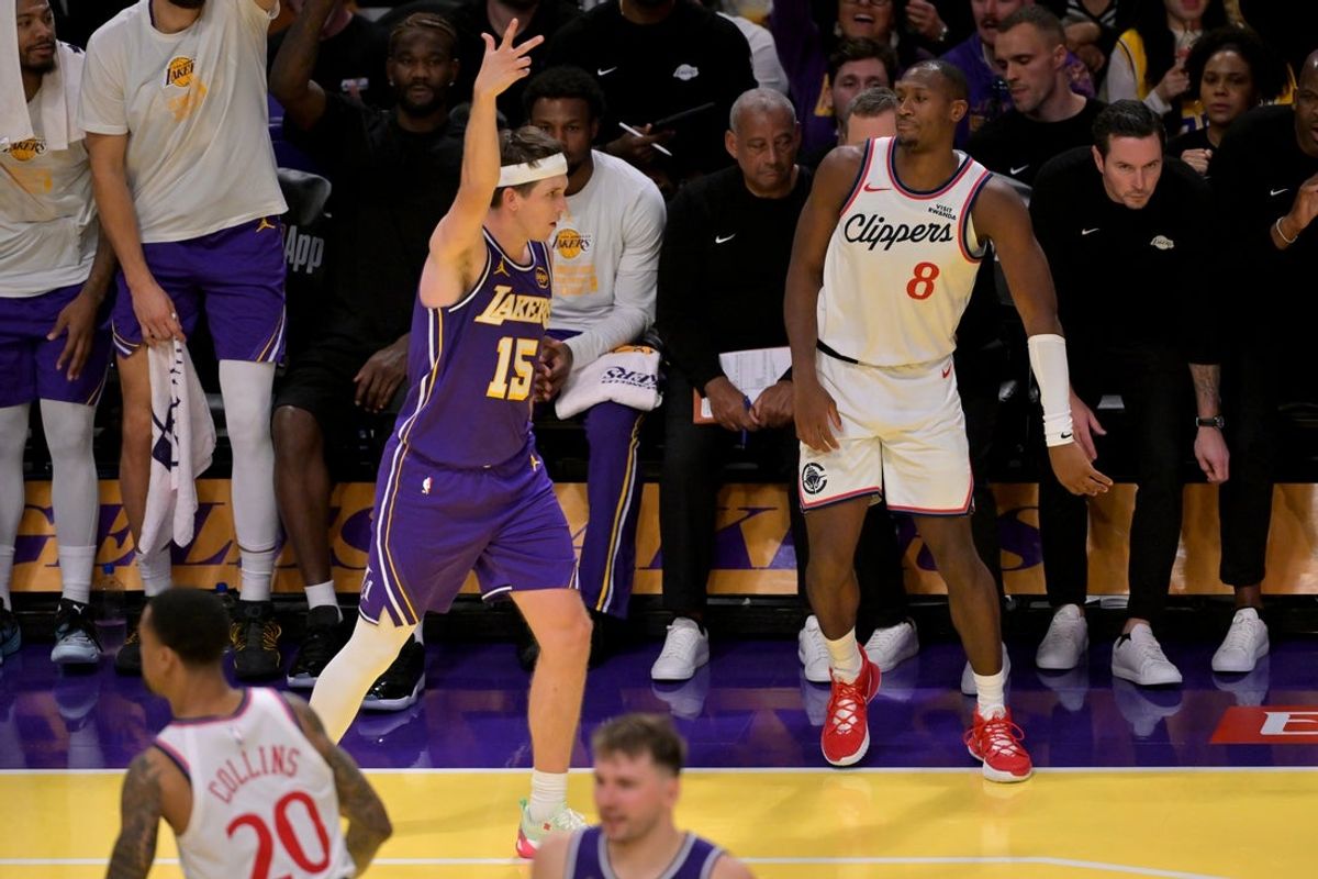 Nov 25, 2025; Los Angeles, California, USA;  Los Angeles Lakers guard Austin Reaves (15) reacts after a 3-point basket in the second half against the Los Angeles Clippers at Crypto.com Arena. Mandatory Credit: Jayne Kamin-Oncea-Imagn Images