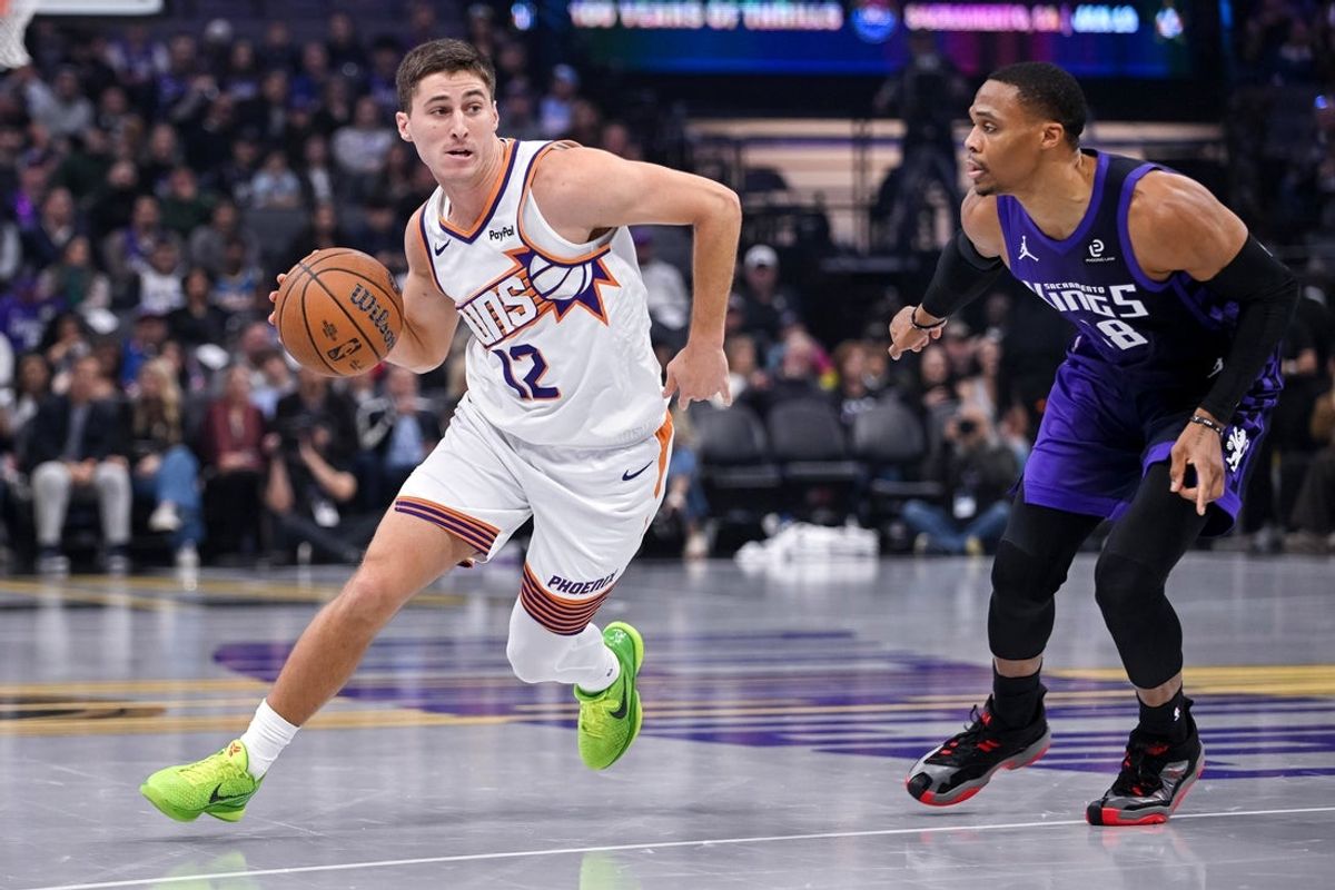 Nov 26, 2025; Sacramento, California, USA; Phoenix Suns guard Collin Gillespie (12) drives to the basket against the Sacramento Kings during the first quarter at Golden 1 Center. Mandatory Credit: Ed Szczepanski-Imagn Images