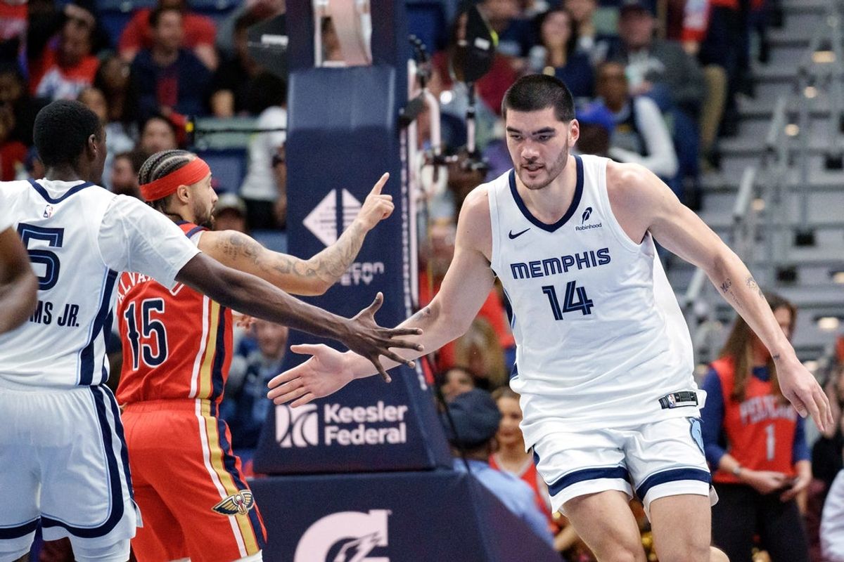 Nov 26, 2025; New Orleans, Louisiana, USA; Memphis Grizzlies center Zach Edey (14) celebrates a score with guard Vince Williams Jr. (5) against the New Orleans Pelicans during the second half at Smoothie King Center. Mandatory Credit: Matthew Hinton-Imagn Images