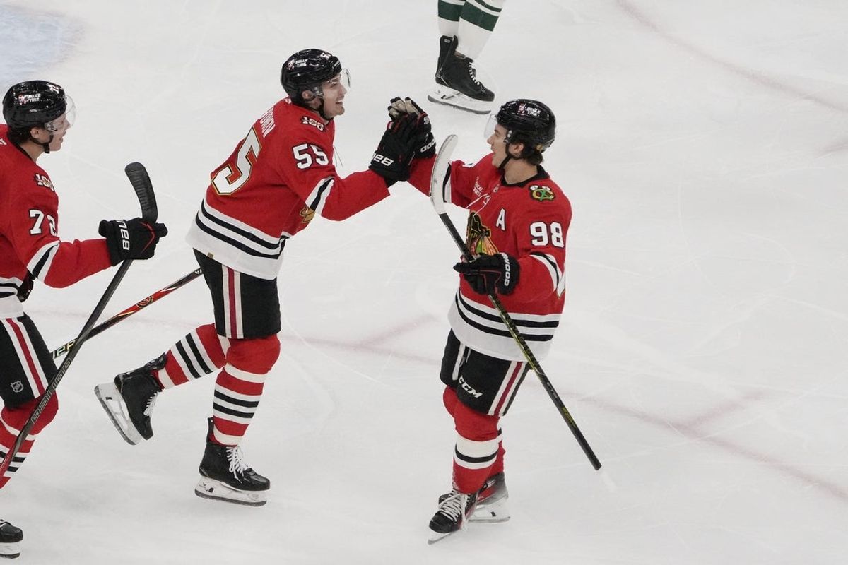 Nov 26, 2025; Chicago, Illinois, USA; Chicago Blackhawks defenseman Artyom Levshunov (55) celebrates his goal against the Minnesota Wild  with  center Connor Bedard (98) during the third period at United Center. Mandatory Credit: David Banks-Imagn Images