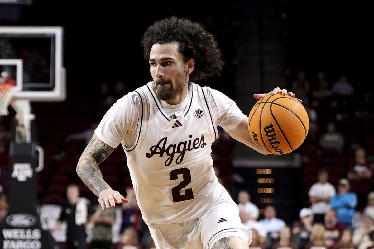 Nov 25, 2025; College Station, Texas, USA; Texas A&M Aggies guard Pop Isaacs (2) dribbles the ball during the first half against the Mississippi Valley State Delta Devils at Reed Arena. Mandatory Credit: Maria Lysaker-Imagn Images