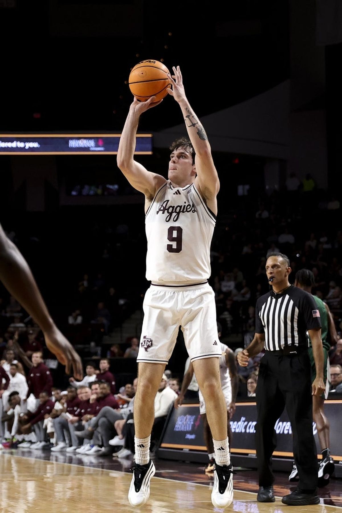 Nov 25, 2025; College Station, Texas, USA; Texas A&M Aggies guard Ruben Dominguez (9) shoots a three point basket during the first half against the Mississippi Valley State Delta Devils at Reed Arena. Mandatory Credit: Maria Lysaker-Imagn Images