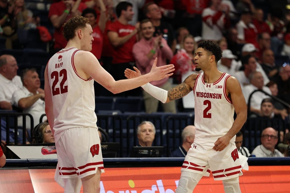 Nov 27, 2025; San Diego, CA, USA; Wisconsin Badgers guard Nick Boyd (2) reacts with Wisconsin Badgers forward Austin Rapp (22) after scoring against the Providence Friars during the second half at Jenny Craig Pavilion. Mandatory Credit: Abe Arredondo-Imagn Images