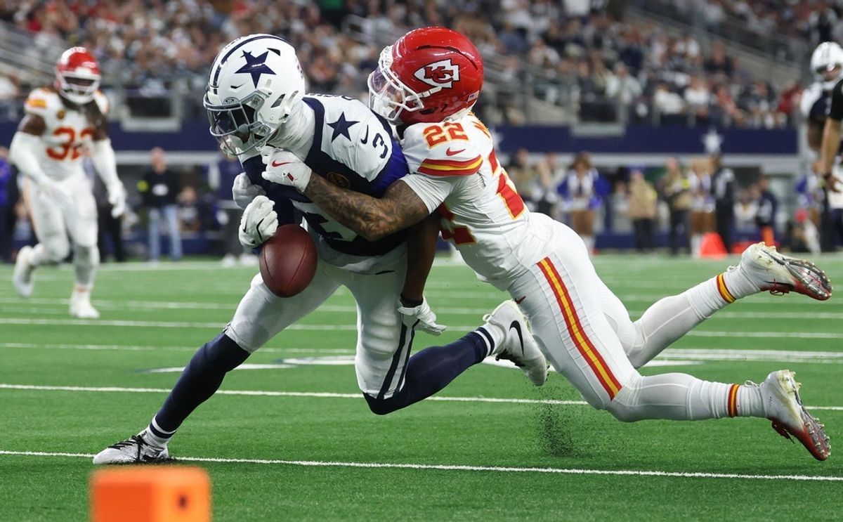 Nov 27, 2025; Arlington, Texas, USA; Kansas City Chiefs cornerback Trent McDuffie (22) forces a fumble from Dallas Cowboys wide receiver George Pickens (3) during the fourth quarter at AT&T Stadium. Mandatory Credit: Kevin Jairaj-Imagn Images