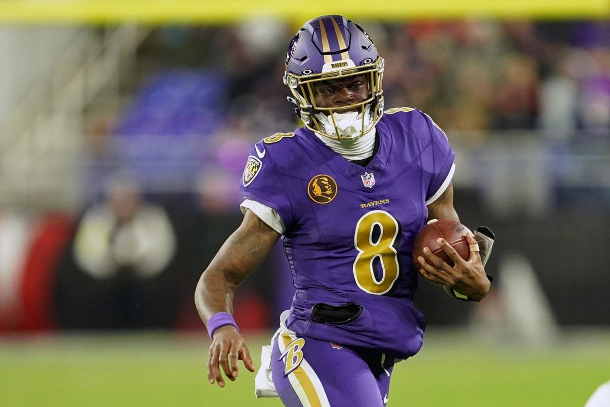 Nov 27, 2025; Baltimore, Maryland, USA; Baltimore Ravens quarterback Lamar Jackson (8) rushes the ball against the Cincinnati Bengals during the second half at M&T Bank Stadium. Mandatory Credit: Mitch Stringer-Imagn Images