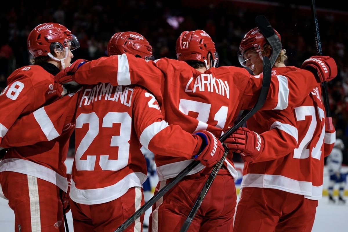 Nov 28, 2025; Detroit, Michigan, USA; Detroit Red Wings center Dylan Larkin (71) celebrates with his teammates after scoring a goal against the Tampa Bay Lightning in the second period at Little Caesars Arena. Mandatory Credit: Lon Horwedel-Imagn Images