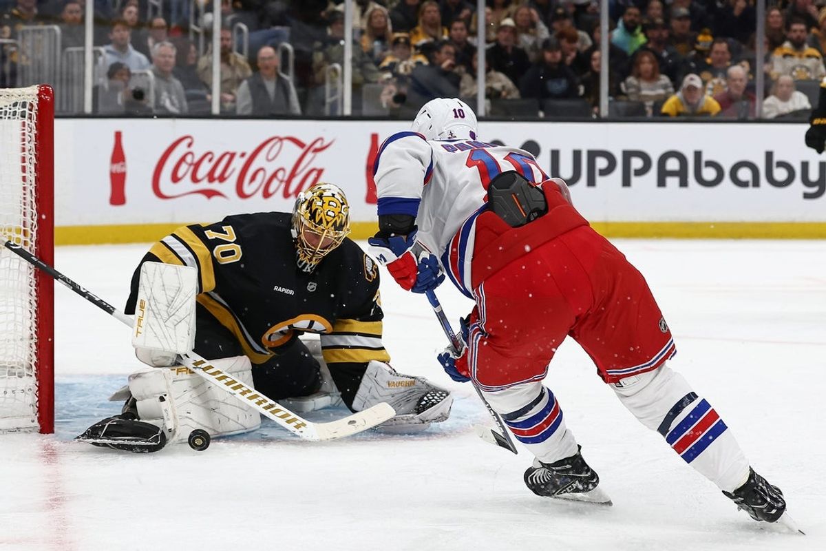 Nov 28, 2025; Boston, Massachusetts, USA; Boston Bruins goaltender Joonas Korpisalo (70) makes a save as New York Rangers left wing Artemi Panarin (10) looks for the rebound during the second period at TD Garden. Mandatory Credit: Winslow Townson-Imagn Images