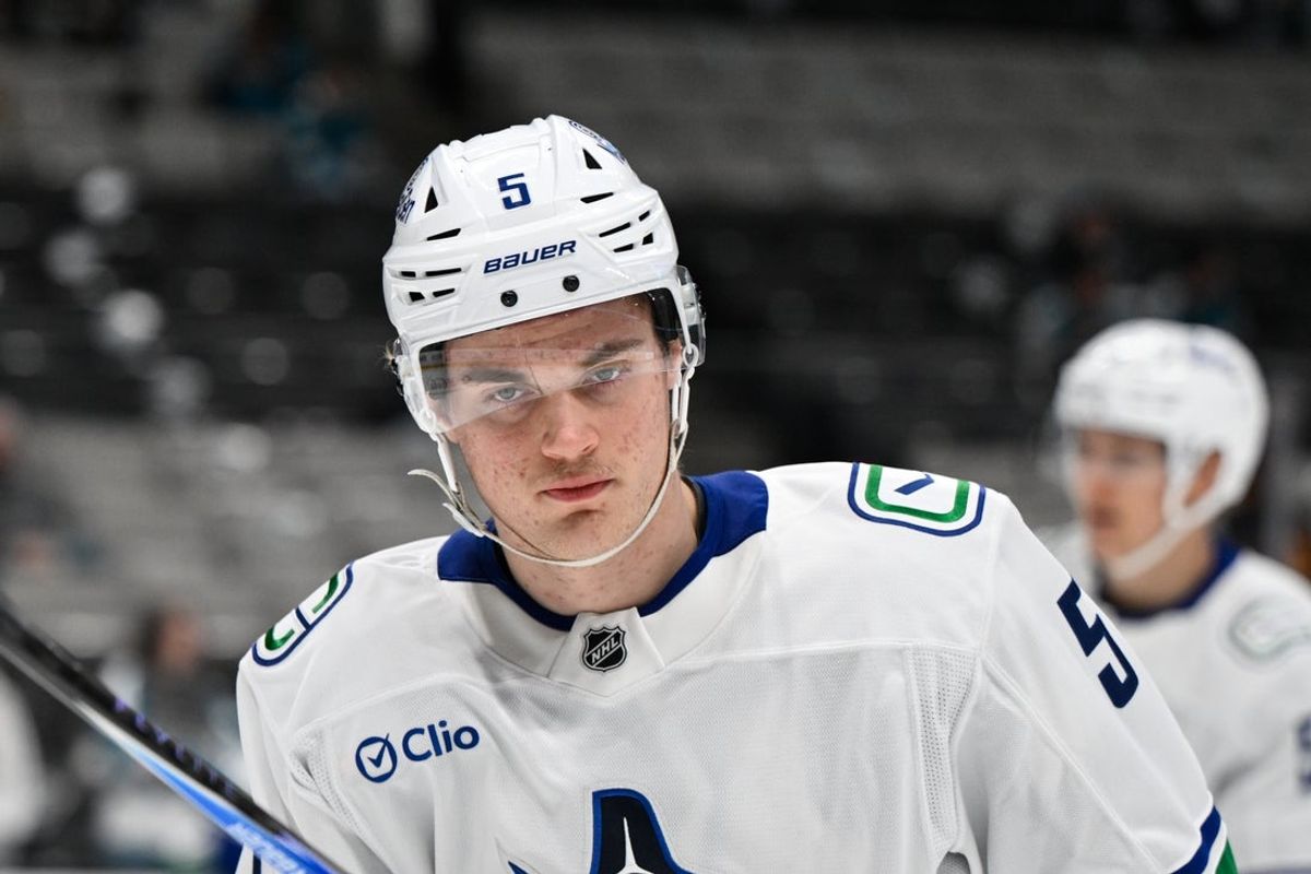 Nov 28, 2025; San Jose, California, USA; Vancouver Canucks defenseman Tom Willander (5) looks on before the game against the San Jose Sharks at SAP Center at San Jose. Mandatory Credit: Eakin Howard-Imagn Images