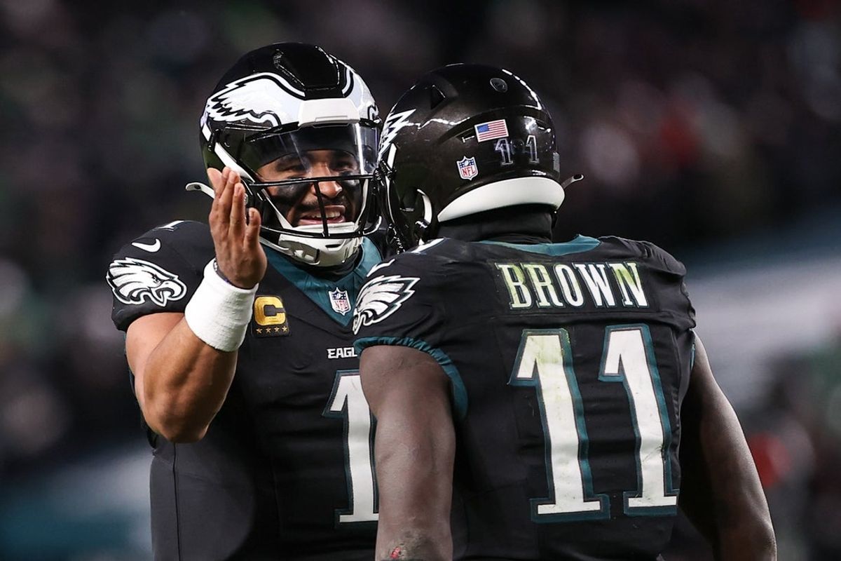 Nov 28, 2025; Philadelphia, Pennsylvania, USA; Philadelphia Eagles quarterback Jalen Hurts (1) and wide receiver A.J. Brown (11) celebrate a touchdown against the Chicago Bears during the third quarter of the game at Lincoln Financial Field. Mandatory Credit: Bill Streicher-Imagn Images