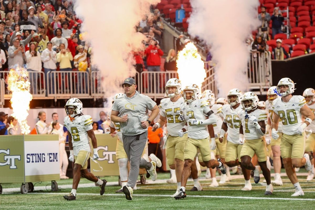 Nov 28, 2025; Atlanta, Georgia, USA; Georgia Tech Yellow Jackets head coach Brent Key leads the team on the field before a game against the Georgia Bulldogs at Mercedes-Benz Stadium. Mandatory Credit: Brett Davis-Imagn Images