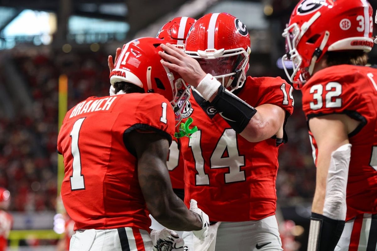 Nov 28, 2025; Atlanta, Georgia, USA; Georgia Bulldogs wide receiver Zachariah Branch (1) celebrates after a touchdown catch with quarterback Gunner Stockton (14) against the Georgia Tech Yellow Jackets in the second quarter at Mercedes-Benz Stadium. Mandatory Credit: Brett Davis-Imagn Images