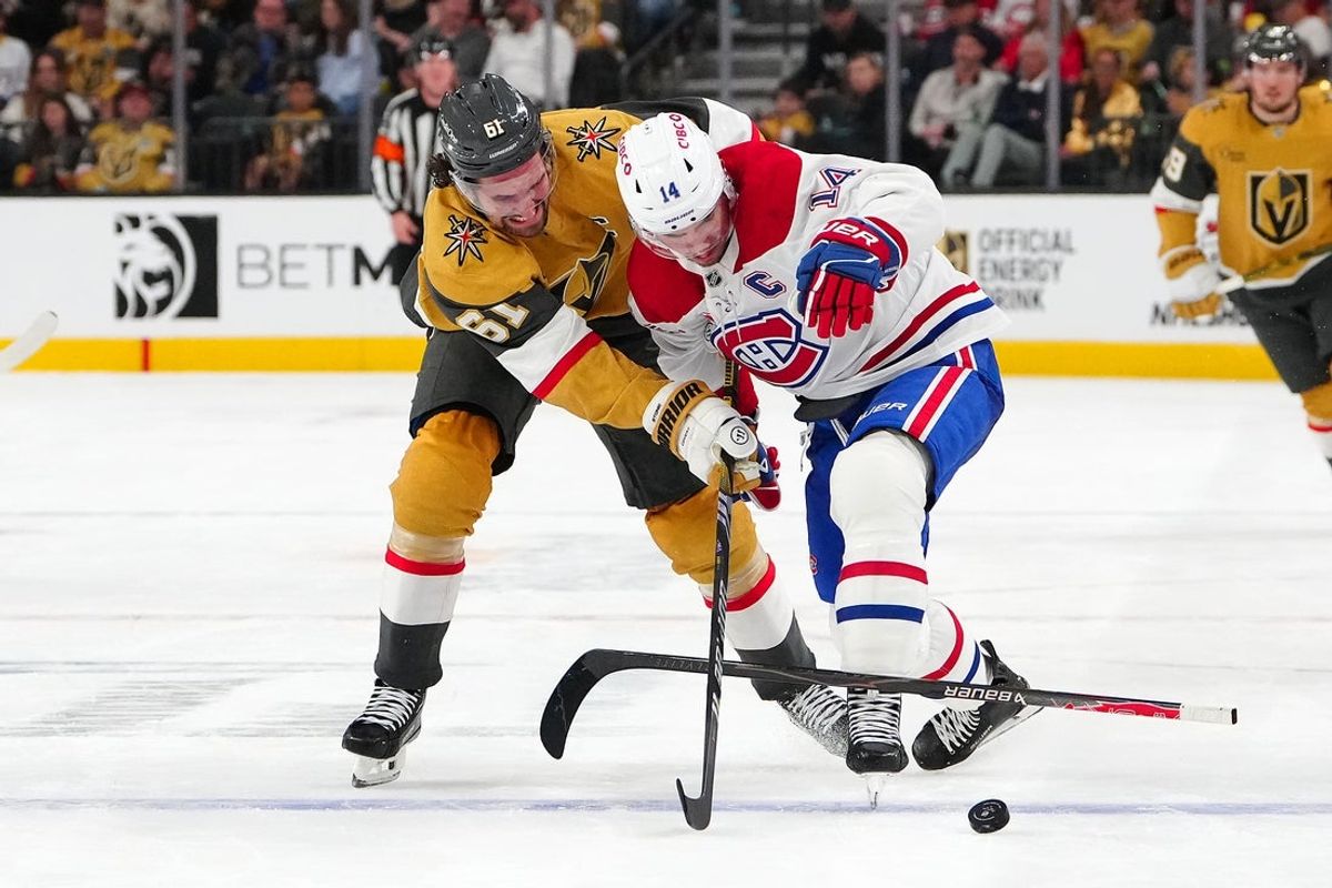 Nov 28, 2025; Las Vegas, Nevada, USA; Vegas Golden Knights right wing Mark Stone (61) battles Montréal Canadiens center Nick Suzuki (14) for the puck during the second period at T-Mobile Arena. Mandatory Credit: Stephen R. Sylvanie-Imagn Images