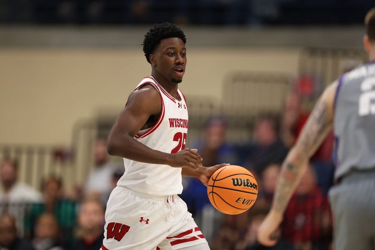 Nov 28, 2025; San Diego, CA, USA; Wisconsin Badgers guard John Blackwell (25) handles the ball against the Texas Christian University Horned Frogs during the first half at Jenny Craig Pavilion. Mandatory Credit: Abe Arredondo-Imagn Images