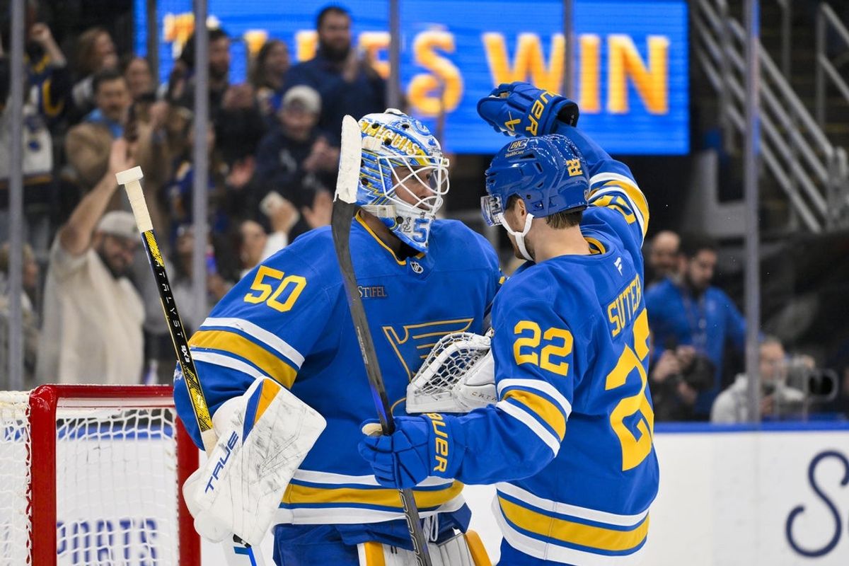 Nov 28, 2025; St. Louis, Missouri, USA; St. Louis Blues goaltender Jordan Binnington (50) celebrates with center Pius Suter (22) after the Blues defeated the Ottawa Senators at Enterprise Center. Mandatory Credit: Jeff Curry-Imagn Images