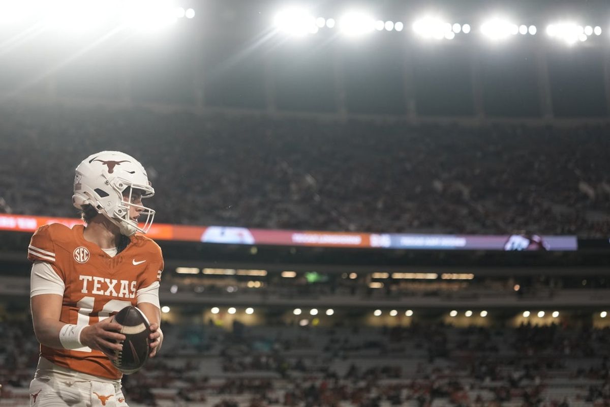Nov 28, 2025; Austin, Texas, USA; Texas Longhorns quarterback Arch Manning warms up before a game against the Texas A&M Aggies at Darrell K Royal-Texas Memorial Stadium. Mandatory Credit: Scott Wachter-Imagn Images