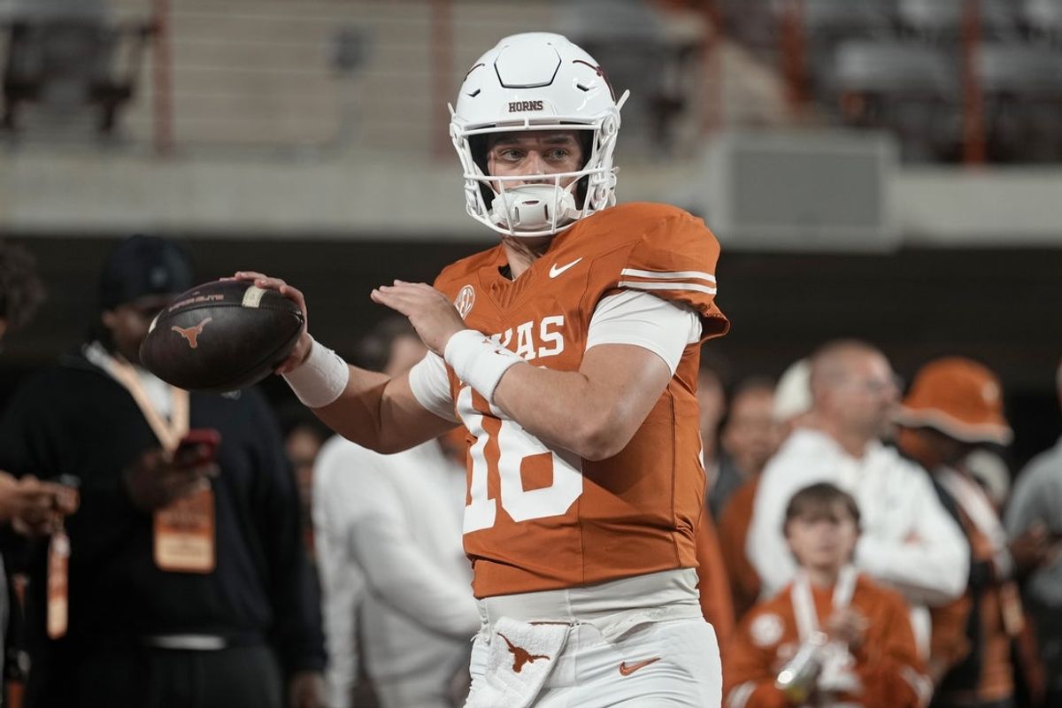 Nov 28, 2025; Austin, Texas, USA; Texas Longhorns quarterback Arch Manning warms up before a game against the Texas A&M Aggies at Darrell K Royal-Texas Memorial Stadium. Mandatory Credit: Scott Wachter-Imagn Images