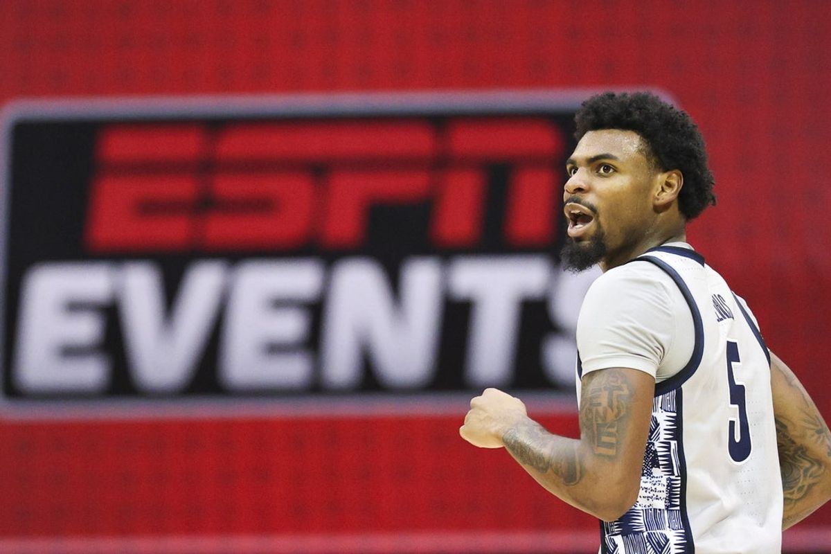 Nov 28, 2025; Kissimmee, FL, USA; Georgetown Hoyas guard Kj Lewis (5) looks onagainst the Miami (FL) Hurricanes in the first half during the ESPN Events Invitational at State Farm Field House. Mandatory Credit: Nathan Ray Seebeck-Imagn Images