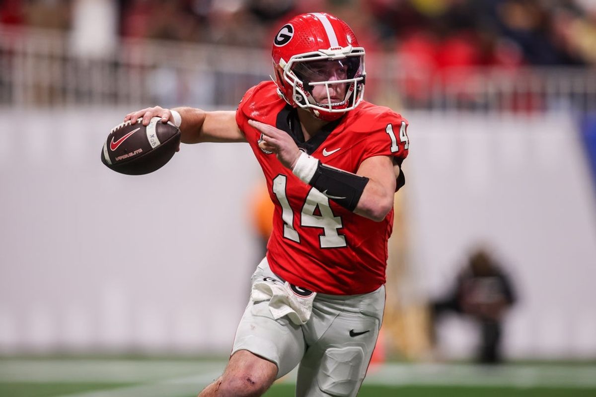 Nov 28, 2025; Atlanta, Georgia, USA; Georgia Bulldogs quarterback Gunner Stockton (14) throws a pass against the Georgia Tech Yellow Jackets in the third quarter at Mercedes-Benz Stadium. Mandatory Credit: Brett Davis-Imagn Images