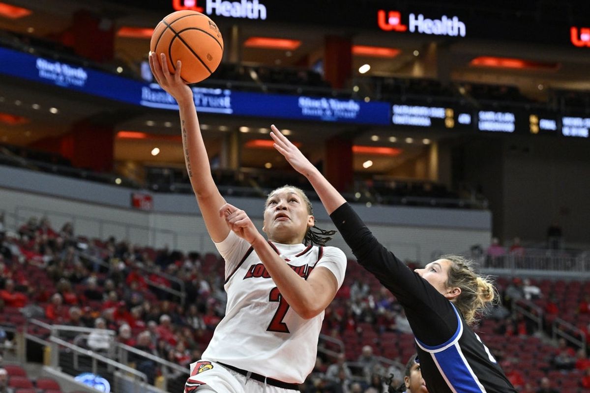 Nov 28, 2025; Louisville, Kentucky, USA;  Louisville Cardinals guard Imari Berry (2) shoots against /Eastern Illinois Panthers forward Ella Lune (1) during the first half at KFC Yum! Center. Mandatory Credit: Jamie Rhodes-Imagn Images