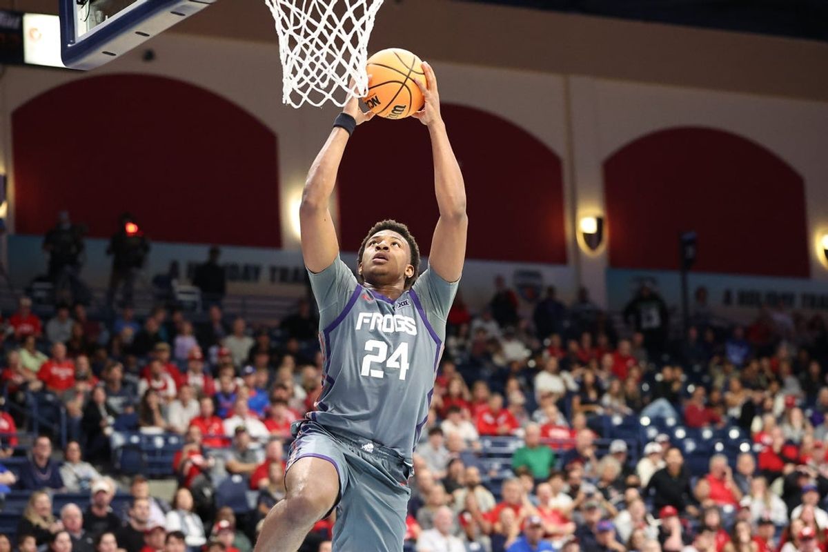 Nov 28, 2025; San Diego, CA, USA; Texas Christian University Horned Frogs forward Xavier Edmonds (24) dunks the ball against the Wisconsin Badgers during the second half at Jenny Craig Pavilion. Mandatory Credit: Abe Arredondo-Imagn Images