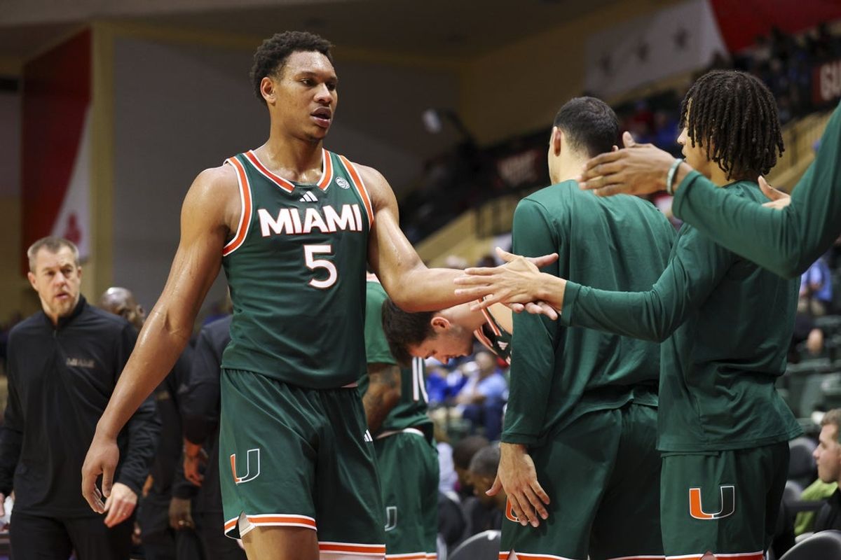 Nov 28, 2025; Kissimmee, FL, USA; Miami (FL) Hurricanes forward Malik Reneau (5) reacts to the beach after being subbed out against the Georgetown Hoyas in the second half during the ESPN Events Invitational at State Farm Field House. Mandatory Credit: Nathan Ray Seebeck-Imagn Images