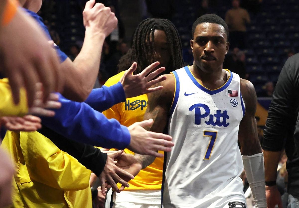 Nov 28, 2025; Pittsburgh, Pennsylvania, USA;  Pittsburgh Panthers guard Damarco Minor (7) celebrates with the student section after making a game winning three-point basket to defeat the Ohio State Buckeyes at the Petersen Events Center. Mandatory Credit: Charles LeClaire-Imagn Images