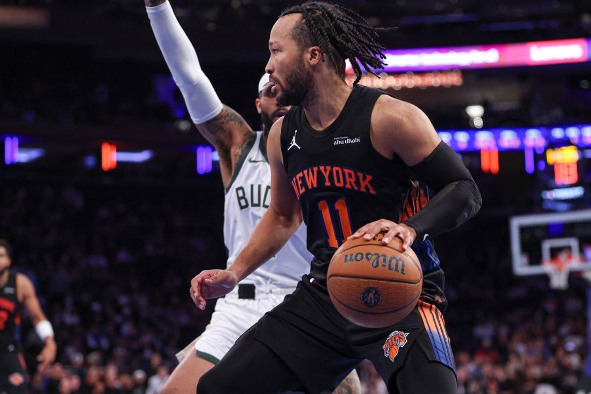 Nov 28, 2025; New York, New York, USA; New York Knicks guard Jalen Brunson (11) dribbles as Milwaukee Bucks guard Gary Trent Jr. (5) defends during the second half at Madison Square Garden. Mandatory Credit: Vincent Carchietta-Imagn Images