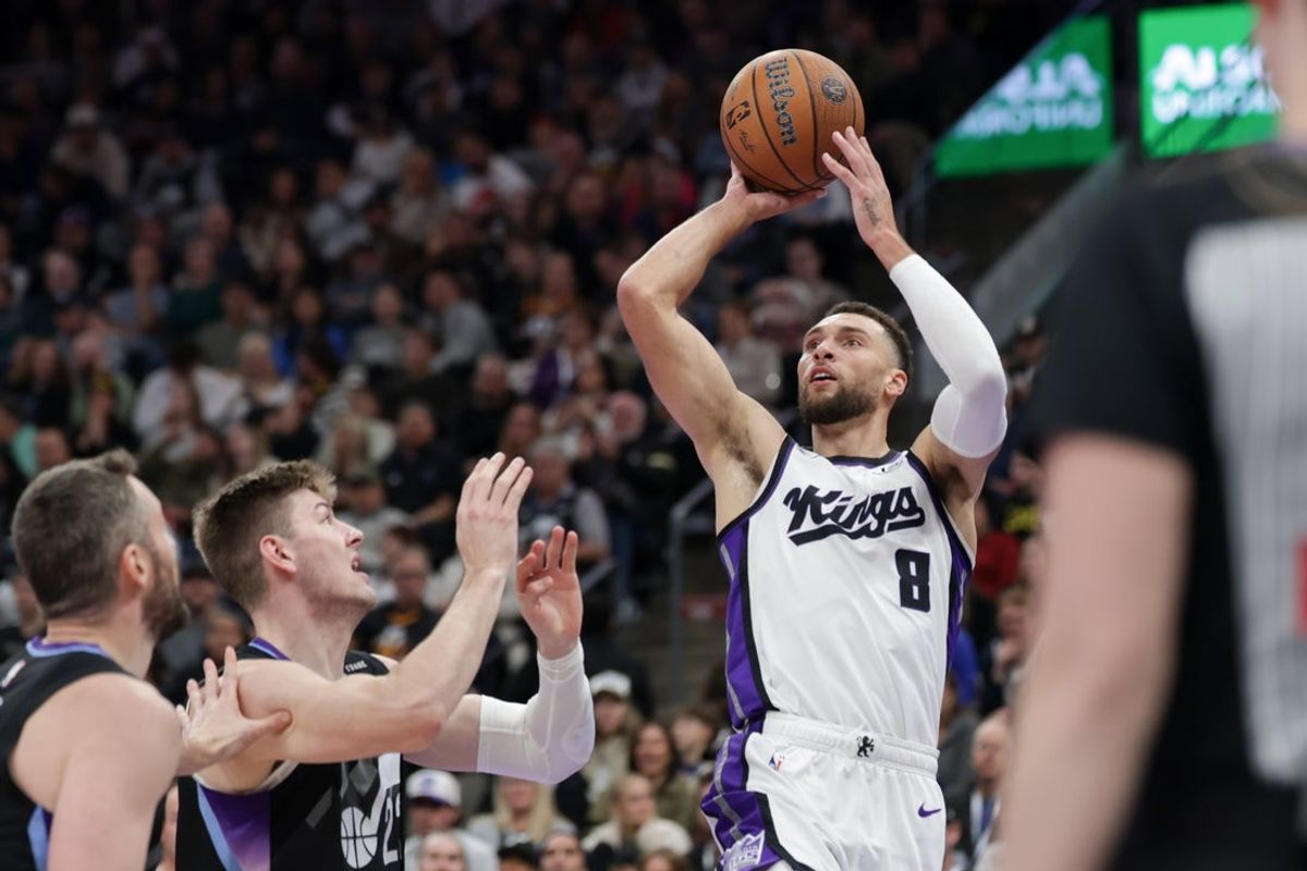 Nov 28, 2025; Salt Lake City, Utah, USA; Sacramento Kings guard Zach LaVine (8) shoots the ball past Utah Jazz forward Kyle Filipowski (22) during the second quarter at Delta Center. Mandatory Credit: Chris Nicoll-Imagn Images