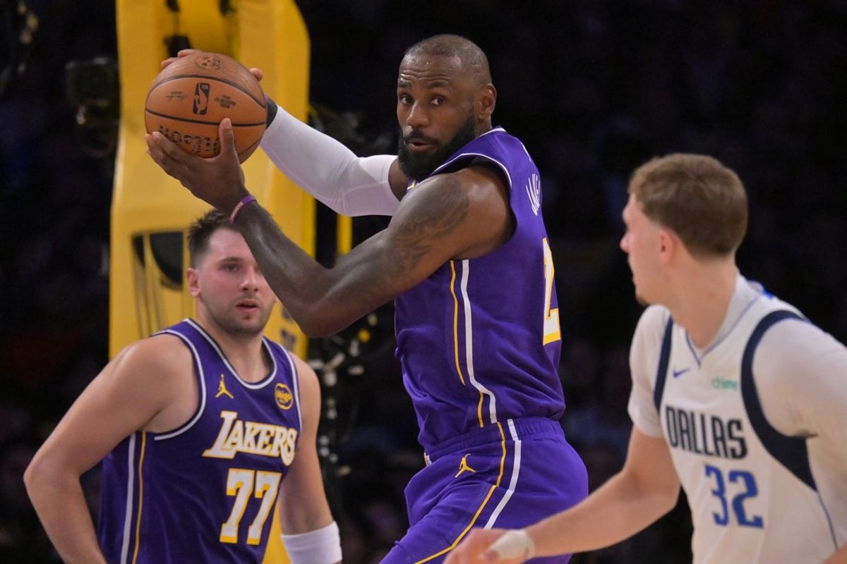 Nov 28, 2025; Los Angeles, California, USA;  Los Angeles Lakers forward LeBron James (23) rebounds in the first half against the Dallas Mavericks at Crypto.com Arena. Mandatory Credit: Jayne Kamin-Oncea-Imagn Images
