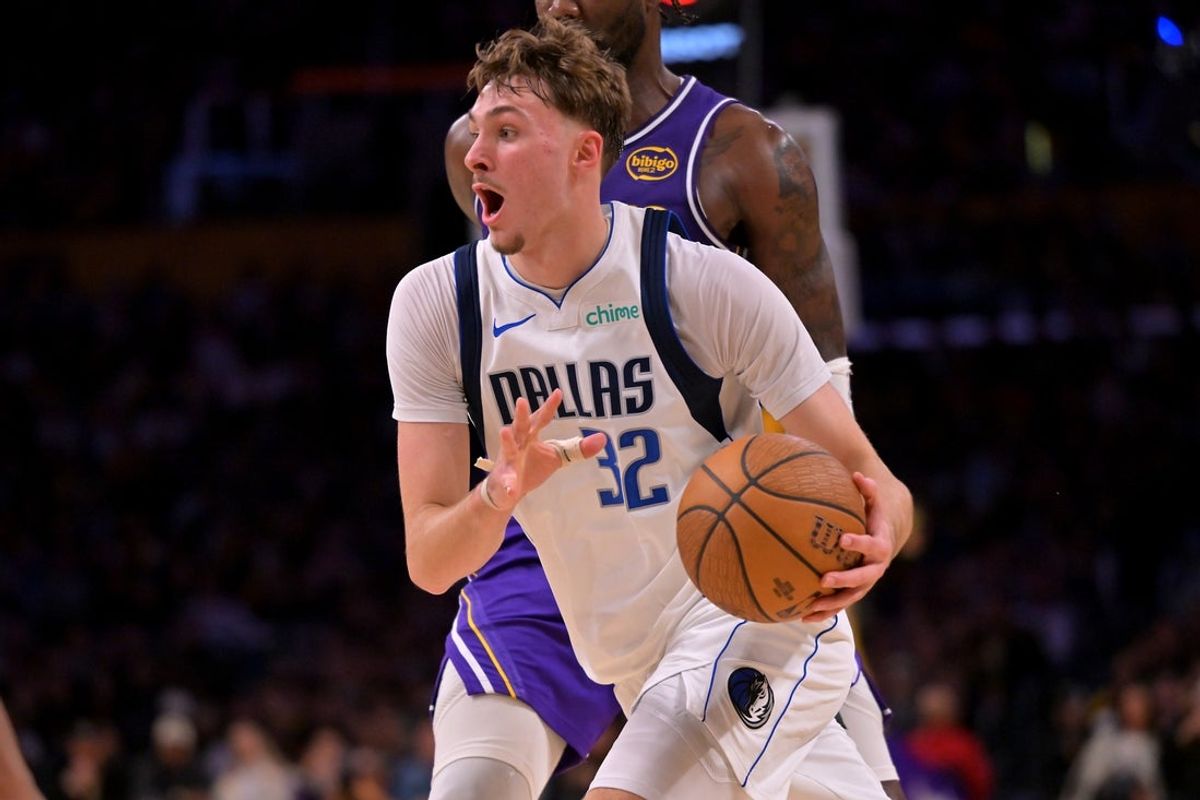 Nov 28, 2025; Los Angeles, California, USA;  Dallas Mavericks forward Cooper Flagg (32) drives to the basket in the second half against the Los Angeles Lakers at Crypto.com Arena. Mandatory Credit: Jayne Kamin-Oncea-Imagn Images