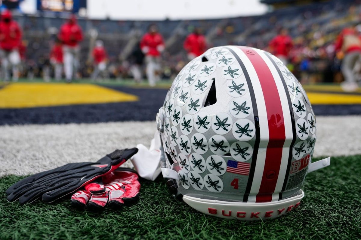 The helmet of Ohio State Buckeyes wide receiver Jeremiah Smith sits on the sideline prior to the NCAA football game against the Michigan Wolverines at Michigan Stadium in Ann Arbor, Mich. on Nov. 29, 2025.