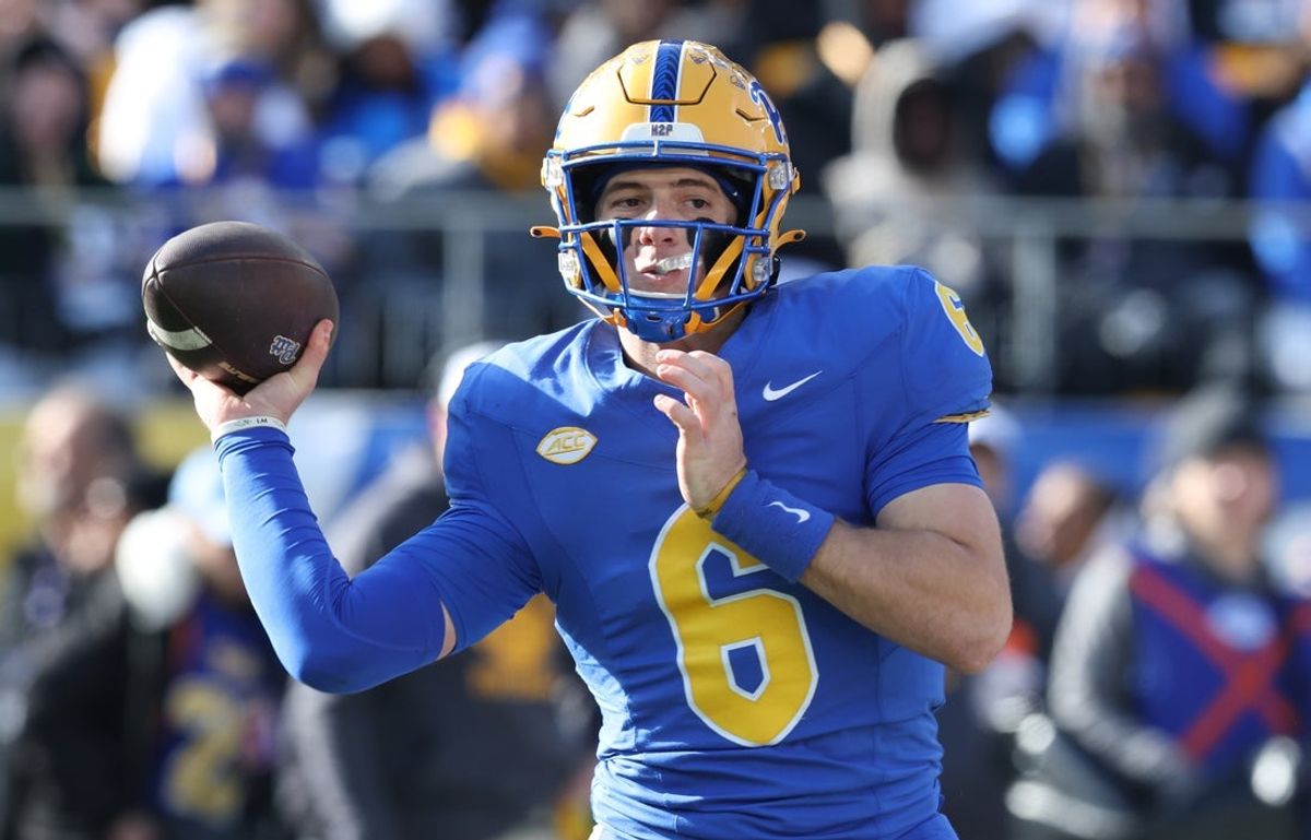 Nov 29, 2025; Pittsburgh, Pennsylvania, USA;  Pittsburgh Panthers quarterback Mason Heintschel (6) passes against the Miami Hurricanes during the first quarter at Acrisure Stadium. Mandatory Credit: Charles LeClaire-Imagn Images