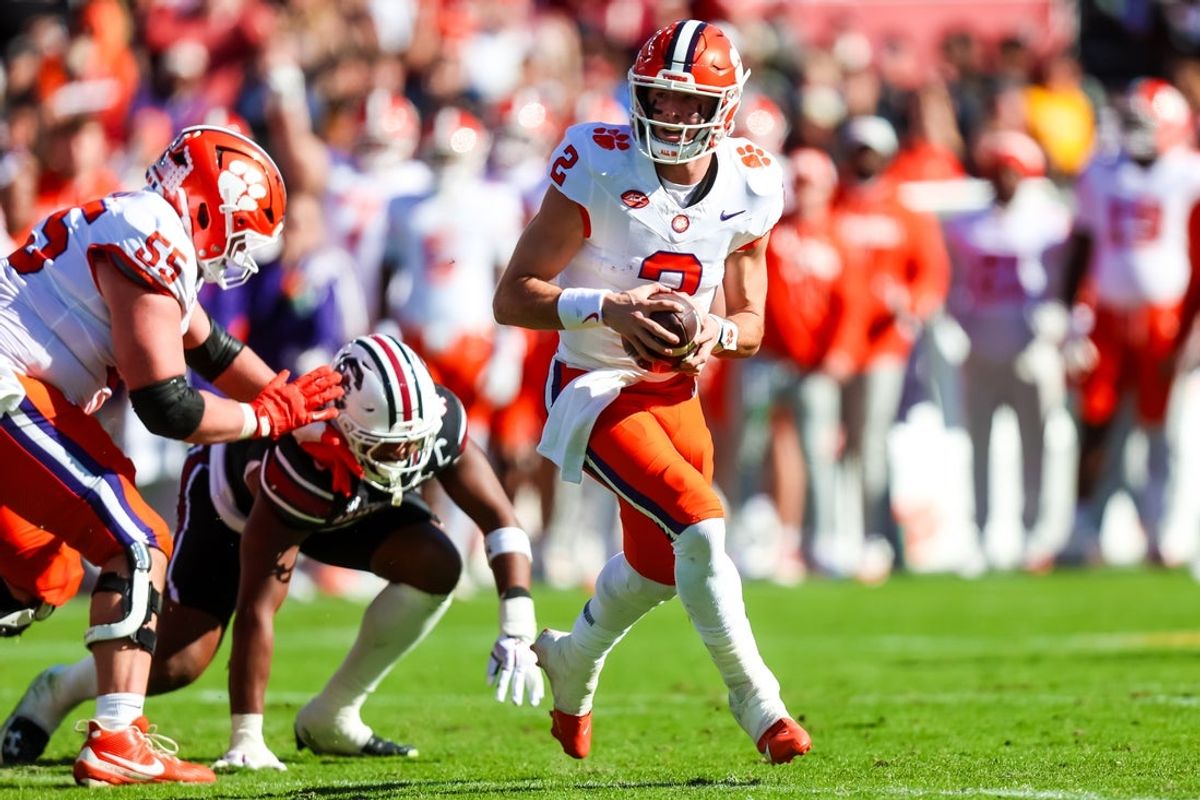 Nov 29, 2025; Columbia, South Carolina, USA; Clemson Tigers quarterback Cade Klubnik (2) scrambles for a touchdown against the South Carolina Gamecocks in the second quarter at Williams-Brice Stadium. Mandatory Credit: Jeff Blake-Imagn Images