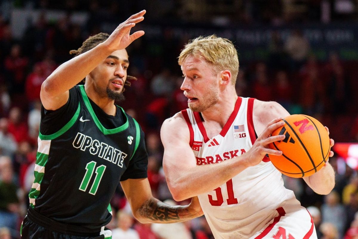 Nov 29, 2025; Lincoln, Nebraska, USA; Nebraska Cornhuskers forward Rienk Mast (51) drives against South Carolina Upstate Spartans forward Learic Davis (11) during the first half at Pinnacle Bank Arena. Mandatory Credit: Dylan Widger-Imagn Images