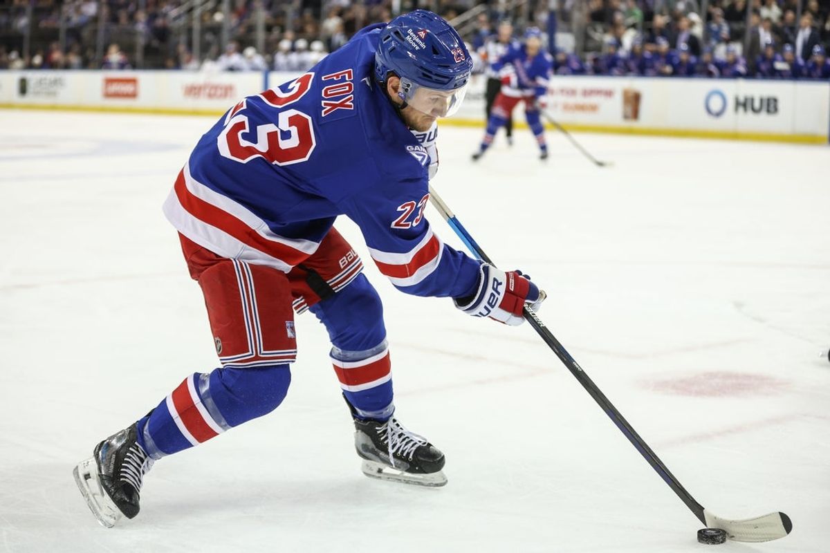 Nov 29, 2025; New York, New York, USA;  New York Rangers defenseman Adam Fox (23) controls the puck in the second period against the Tampa Bay Lightning at Madison Square Garden. Mandatory Credit: Wendell Cruz-Imagn Images