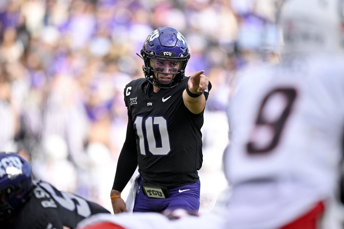 Nov 29, 2025; Fort Worth, Texas, USA; TCU Horned Frogs quarterback Josh Hoover (10) points to Cincinnati Bearcats defensive back Jiquan Sanks (9) during the first quarter at Amon G. Carter Stadium. Mandatory Credit: Jerome Miron-Imagn Images