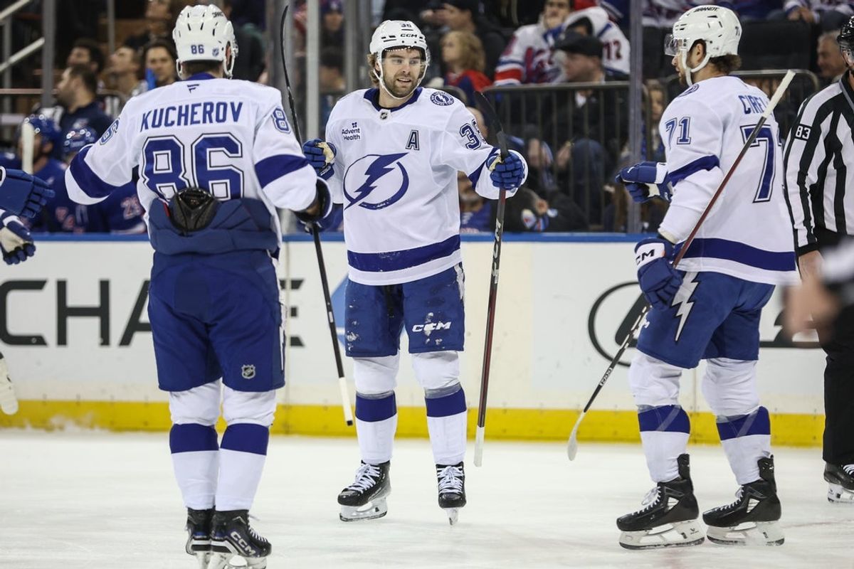 Nov 29, 2025; New York, New York, USA;  Tampa Bay Lightning left wing Brandon Hagel (38) is greeted by right wing Nikita Kucherov (86) and center Anthony Cirelli (71) after scoring a goal in the first period against the New York Rangers at Madison Square Garden. Mandatory Credit: Wendell Cruz-Imagn Images