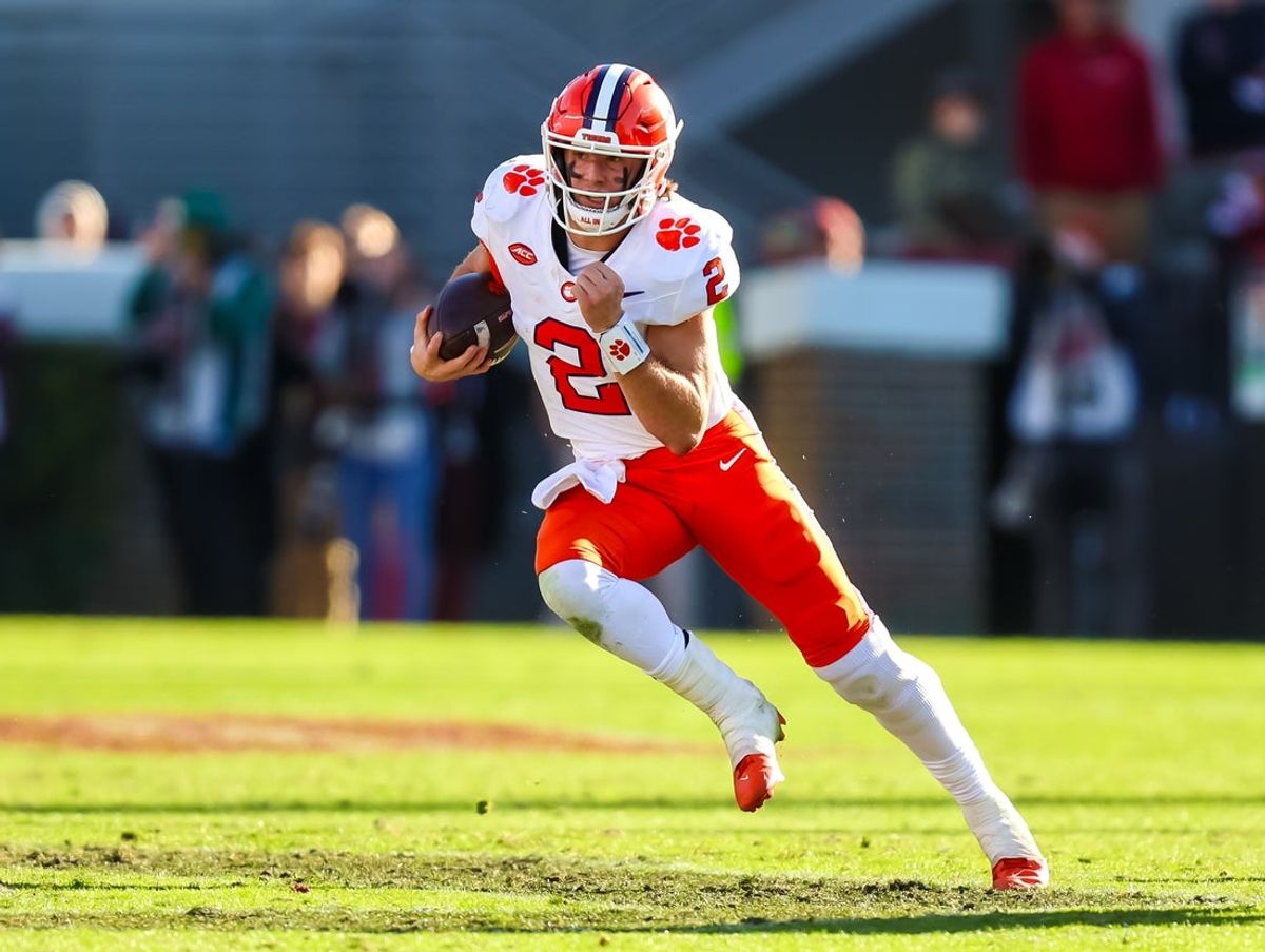 Nov 29, 2025; Columbia, South Carolina, USA; Clemson Tigers quarterback Cade Klubnik (2) rushes against the South Carolina Gamecocks in the second quarter at Williams-Brice Stadium. Mandatory Credit: Jeff Blake-Imagn Images