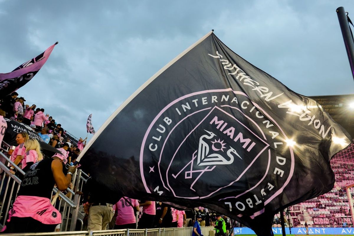 Nov 29, 2025; Fort Lauderdale, Florida, USA; Inter Miami CF fans wave a club flag before the MLS Cup Playoffs Eastern Conference Final against New York City FC at Chase Stadium. Mandatory Credit: Sam Navarro-Imagn Images