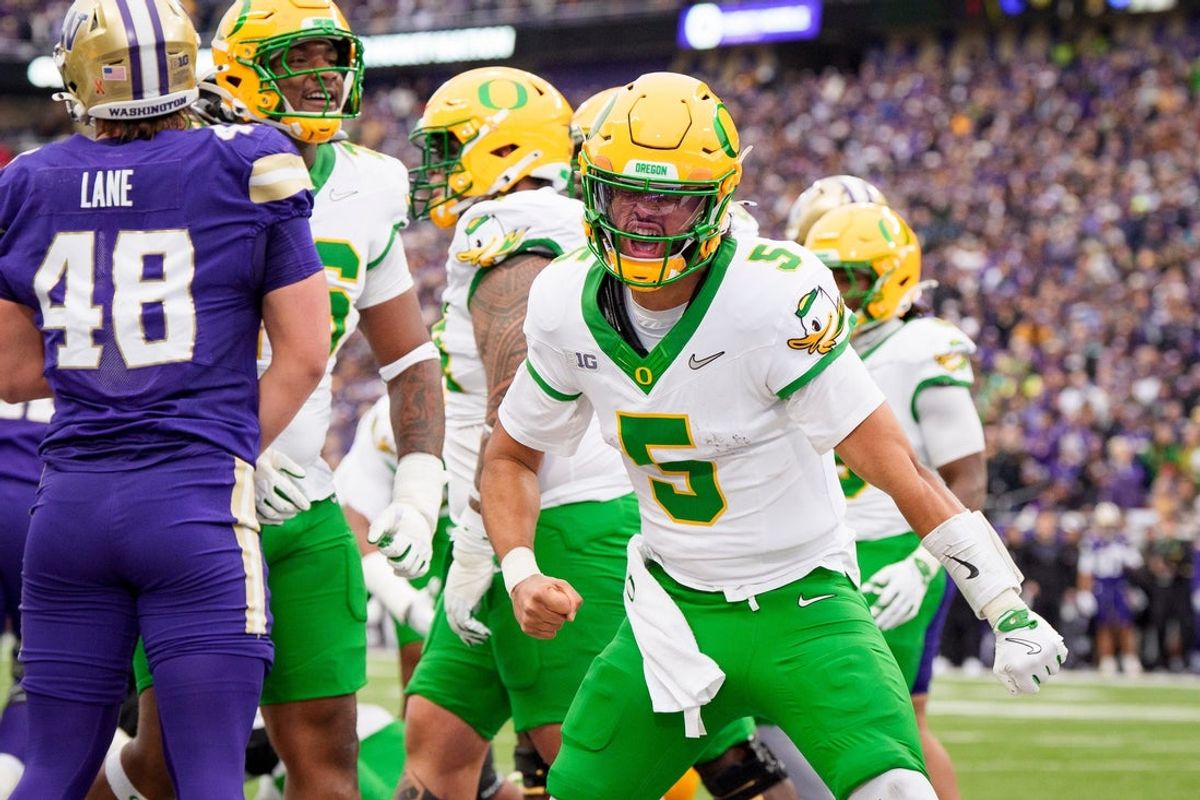 Oregon quarterback Dante Moore celebrates a touchdown as the Oregon Ducks take on the Washington Huskies on Nov. 29, 2025, at Husky Stadium in Seattle, Washington.