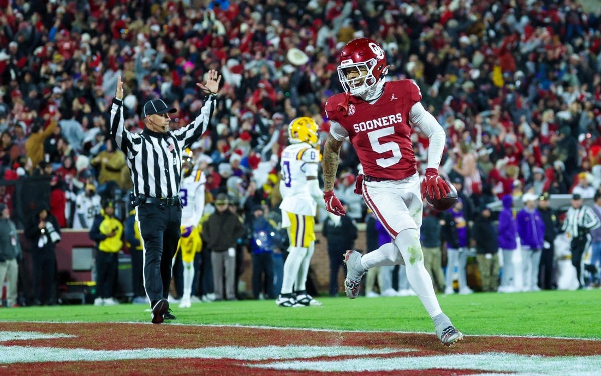 Nov 29, 2025; Norman, Oklahoma, USA;  Oklahoma Sooners wide receiver Isaiah Sategna III (5) makes a touchdown catch during the fourth quarter against the Louisiana State Tigers at Gaylord Family-Oklahoma Memorial Stadium. Mandatory Credit: Kevin Jairaj-Imagn Images