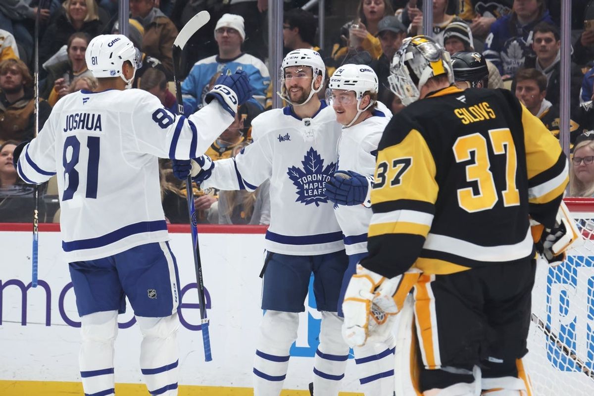 Nov 29, 2025; Pittsburgh, Pennsylvania, USA;  Toronto Maple Leafs center Dakota Joshua (81) and center Nicolas Roy (middle) congratulate center Bobby McMann (74) on his goal against Pittsburgh Penguins goaltender Arturs Silovs (37) during the second period at PPG Paints Arena. Mandatory Credit: Charles LeClaire-Imagn Images